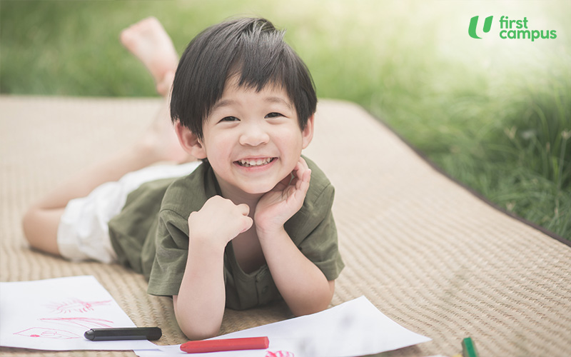 Cute Asian Child Drawing Picture With Crayon