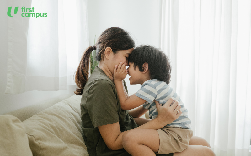 How to prevent temper tantrums - building a sense of trust and safety as attachment theory says. Image shows a mother hugging her child.